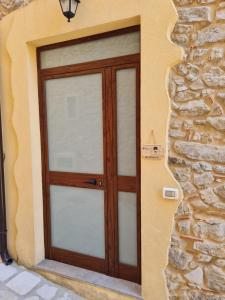 a wooden door on the side of a building at Palazzo B&B in Trentinara