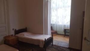 Ένα ή περισσότερα κρεβάτια σε δωμάτιο στο Firuza Hostel