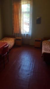 Ένα ή περισσότερα κρεβάτια σε δωμάτιο στο Firuza Hostel