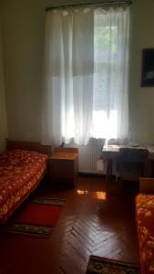 Ένα ή περισσότερα κρεβάτια σε δωμάτιο στο Firuza Hostel