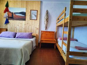 Postel nebo postele na pokoji v ubytování B&B Bivacco Frasassi climbing & trail running house