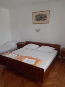 Postel nebo postele na pokoji v ubytování Apartments Vidas