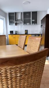 a kitchen with a wooden table and chairs at Suite 110qm nahe Rhein in Krefeld