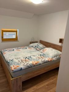 A bed or beds in a room at Apartma ELA