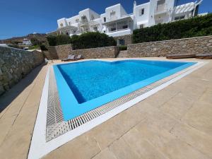 a swimming pool in front of a villa at Villa Elena in Ornos