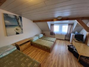 Postel nebo postele na pokoji v ubytování Pokoje u Małgorzaty