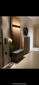 a living room with a couch and a vase of flowers at Luxury Apartment Keramoti in Keramotí