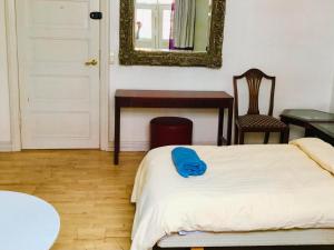 En eller flere senge i et værelse på Guesthouse Copenhagen
