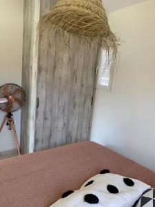 a room with a bed with a fan and a bed with a bed sidx sidx at Agapi home in Áyios Spirídhon