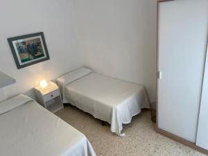 Postel nebo postele na pokoji v ubytování Precioso piso duplex en la Bahia de Cadiz para 5 plazas