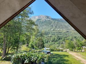 a view from a tent looking out at a mountain at Apartments Radulje Bovec in Bovec