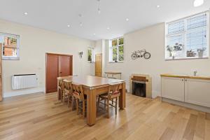 a kitchen and dining room with a table and chairs at The Chapel in Humby