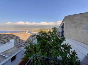 a balcony of a building with a view of the ocean at Evdilos' Balcony in Evdilos