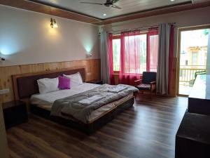 Postel nebo postele na pokoji v ubytování Chandan Guest House