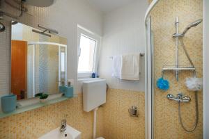 a bathroom with a shower and a sink at Apartman La vista e' bella in Kornić +28 photos
