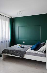 Posteľ alebo postele v izbe v ubytovaní Apartament Miki