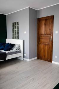 Posteľ alebo postele v izbe v ubytovaní Apartament Miki