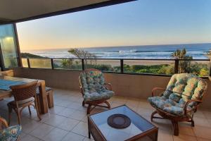 a living room with a view of the ocean at Juanita 202 Margate North Beach in Margate
