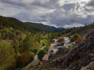 an aerial view of a village in the mountains at La María de Tortas in Paterna del Madera +23 photos