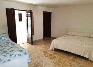 A bed or beds in a room at Il Gaza