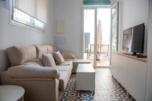 TV a/nebo společenská místnost v ubytování Hauzify I Apartament Can Missé + 17 fotografií