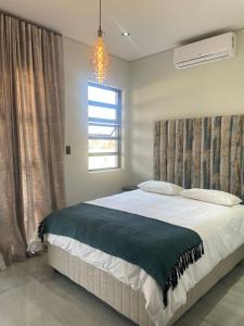 Giường trong phòng chung tại 365@ Vaal De Grace Parys