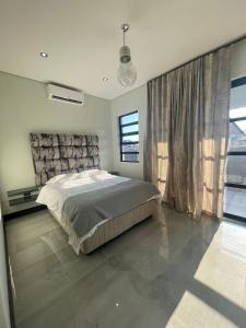 Giường trong phòng chung tại 365@ Vaal De Grace Parys