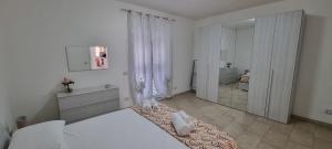Posteľ alebo postele v izbe v ubytovaní Appartamento Centro Niscemi