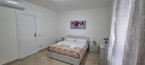 Posteľ alebo postele v izbe v ubytovaní Appartamento Centro Niscemi
