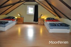 Postel nebo postele na pokoji v ubytování MoorBarg + MoorPütt