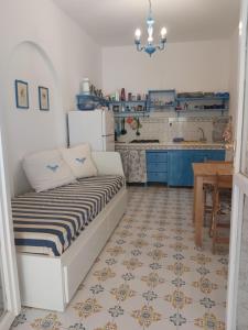 a small kitchen with a bed in a room at R9 in Vulcano +13 photos