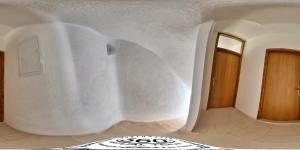 a room with a white wall and a rug at Goldie in Jezera