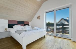 Posteľ alebo postele v izbe v ubytovaní Sun House - Domy Mazur + 37 fotografií