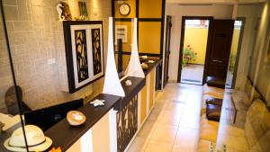 a hallway of a house with a clock on the wall at Saint George Sithonia in Neos Marmaras +83 photos