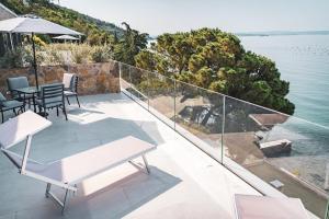 a balcony with a view of the water at Seaside Resort in Trieste