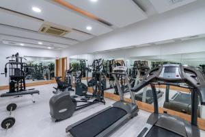 a gym with treadmills ellipticals and exercise bikes at PEARLY HOTEL in Antalya