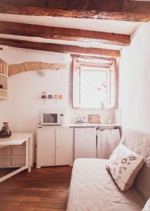 Ένα ή περισσότερα κρεβάτια σε δωμάτιο στο Appartamento Agave - quartiere Castello