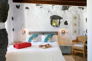 a bedroom with a bed with a tray of food on it at La Casa del Medianero in Mácher +160 photos