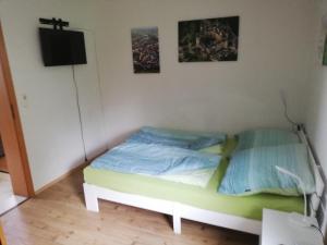 En eller flere senge i et værelse på Ferienwohnung - a44958