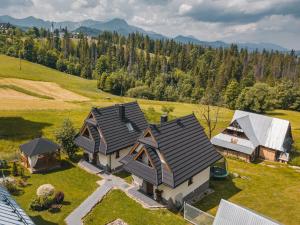 an aerial view of a house in a field at Domki U MAJERCZYKA in Zakopane