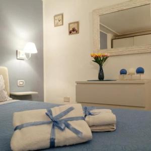 A bed or beds in a room at Quattro Canti Valù