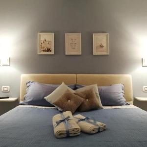 A bed or beds in a room at Quattro Canti Valù