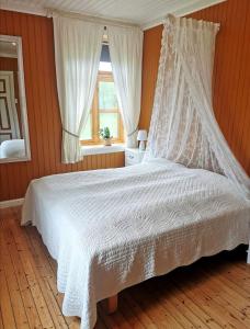Postel nebo postele na pokoji v ubytování Tranøya