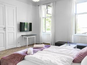 Ένα ή περισσότερα κρεβάτια σε δωμάτιο στο Commodious 2BR Apt. Near AKH-Perfect for Groups