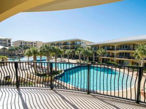 a view of a pool from the balcony of a resort at Adagio #203E in Santa Rosa Beach