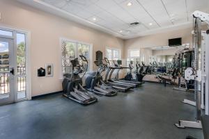 a gym with treadmills and ellipticals in a room at Adagio 203E in Santa Rosa Beach