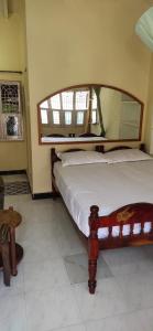 En eller flere senger på et rom på Kalyan Guesthouse
