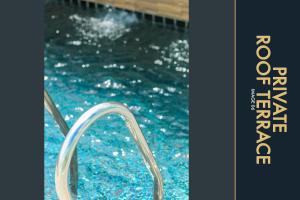 una piscina con scivolo ad acqua di 3 BR Stylish Condo with Private Rooftop Pool a Kamala Beach