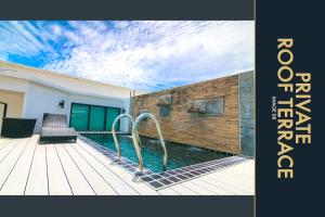 Φωτογραφία από το άλμπουμ του 3 BR Stylish Condo with Private Rooftop Pool στην Παραλία Καμάλα +77 φωτογραφίες