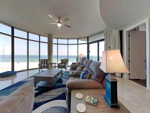 a living room with a couch and a table at Capri #301 in Perdido Key